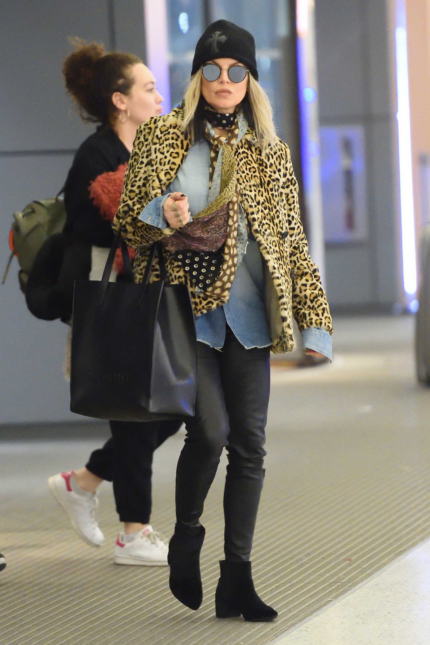 Fergie Wears a Leopard Print Jacket at JFK airport in NYC 12/17/2017