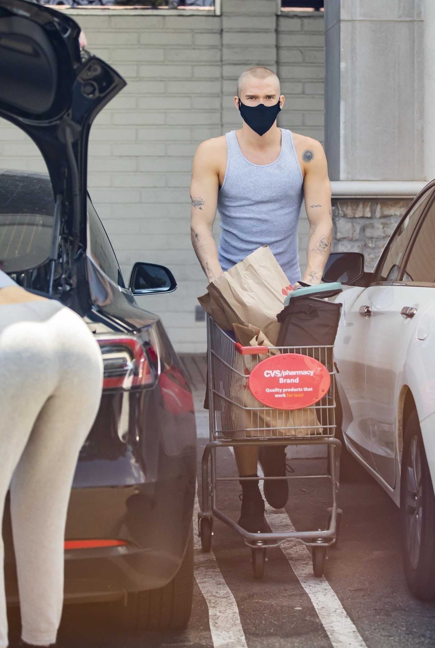 Cody Simpson in a Gray Tank Top Goes Shopping Out with Miley Cyrus at CVS Pharmacy in Calabasas 06/12/2020