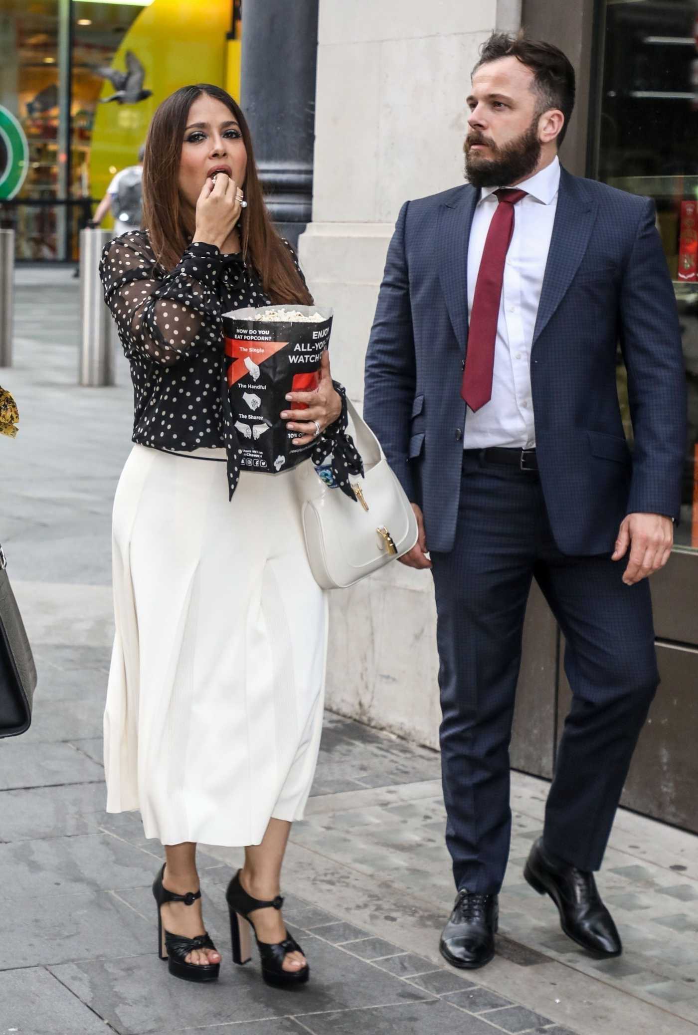 Salma Hayek in a White Skirt Leaves the Premiere of The Hitman's Wife's Bodyguard in London 06/14/2021