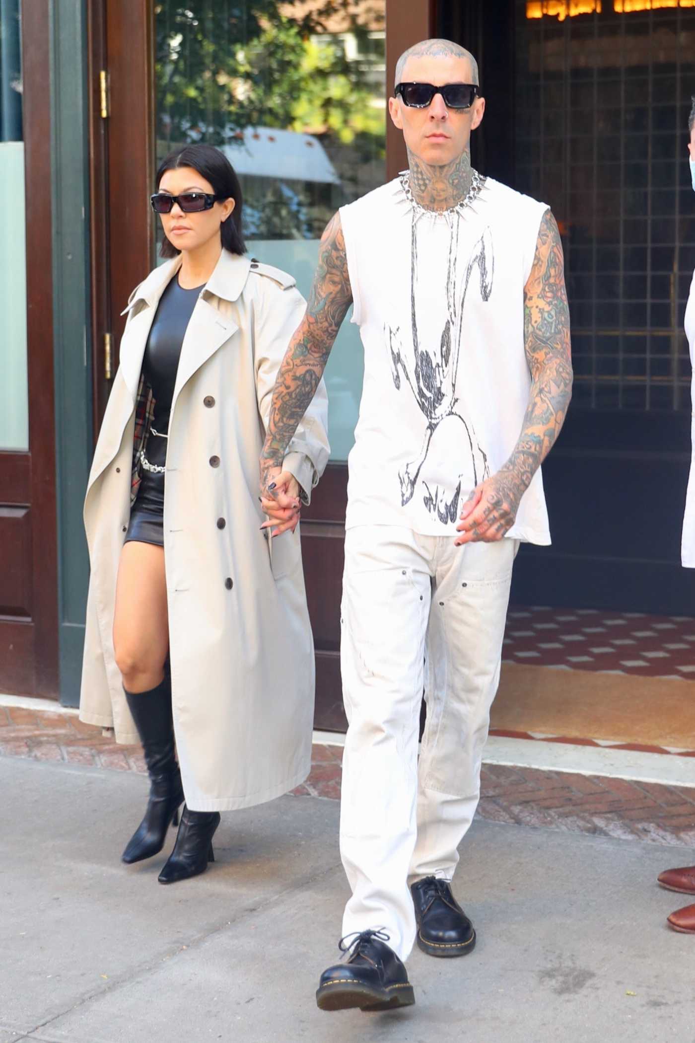 Kourtney Kardashian in a Beige Trench Coat Leaves Her Hotel with Travis Barker in New York 10/15/2021