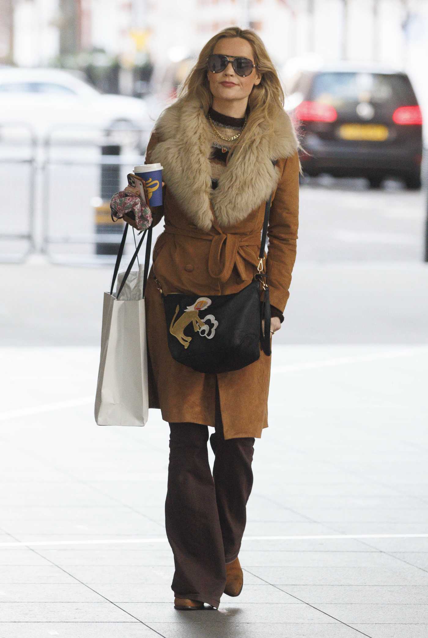 Laura Whitmore in a Caramel Coloured Coat Leaves the BBC New Broadcasting House in London 01/09/2022