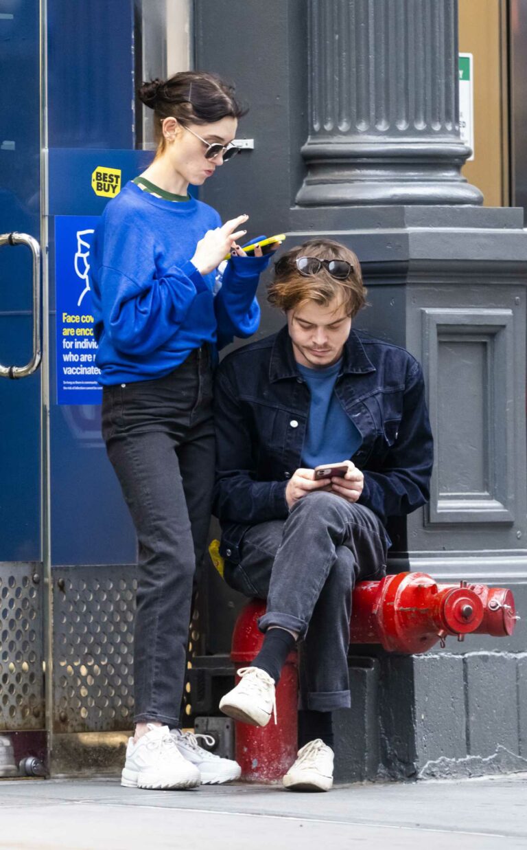 Natalia Dyer in a Blue Sweatshirt