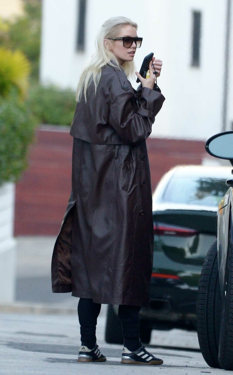 Stella Maxwell in a Brown Trench Coat