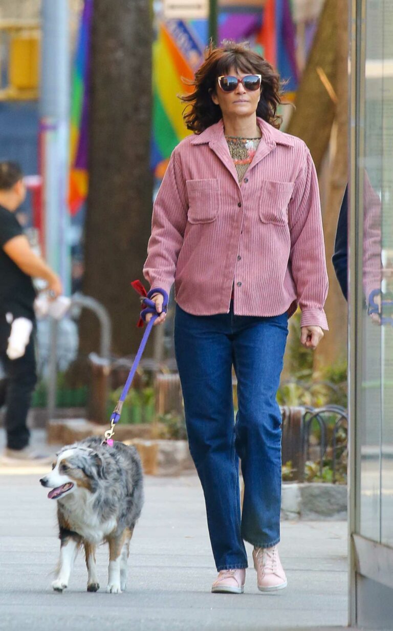 Helena Christensen in a Pink Shirt