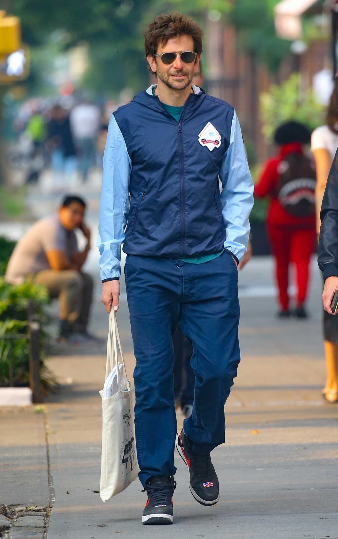 Bradley Cooper in a Blue Jacket Heads for a Coffee Run in New York City 06/07/2023