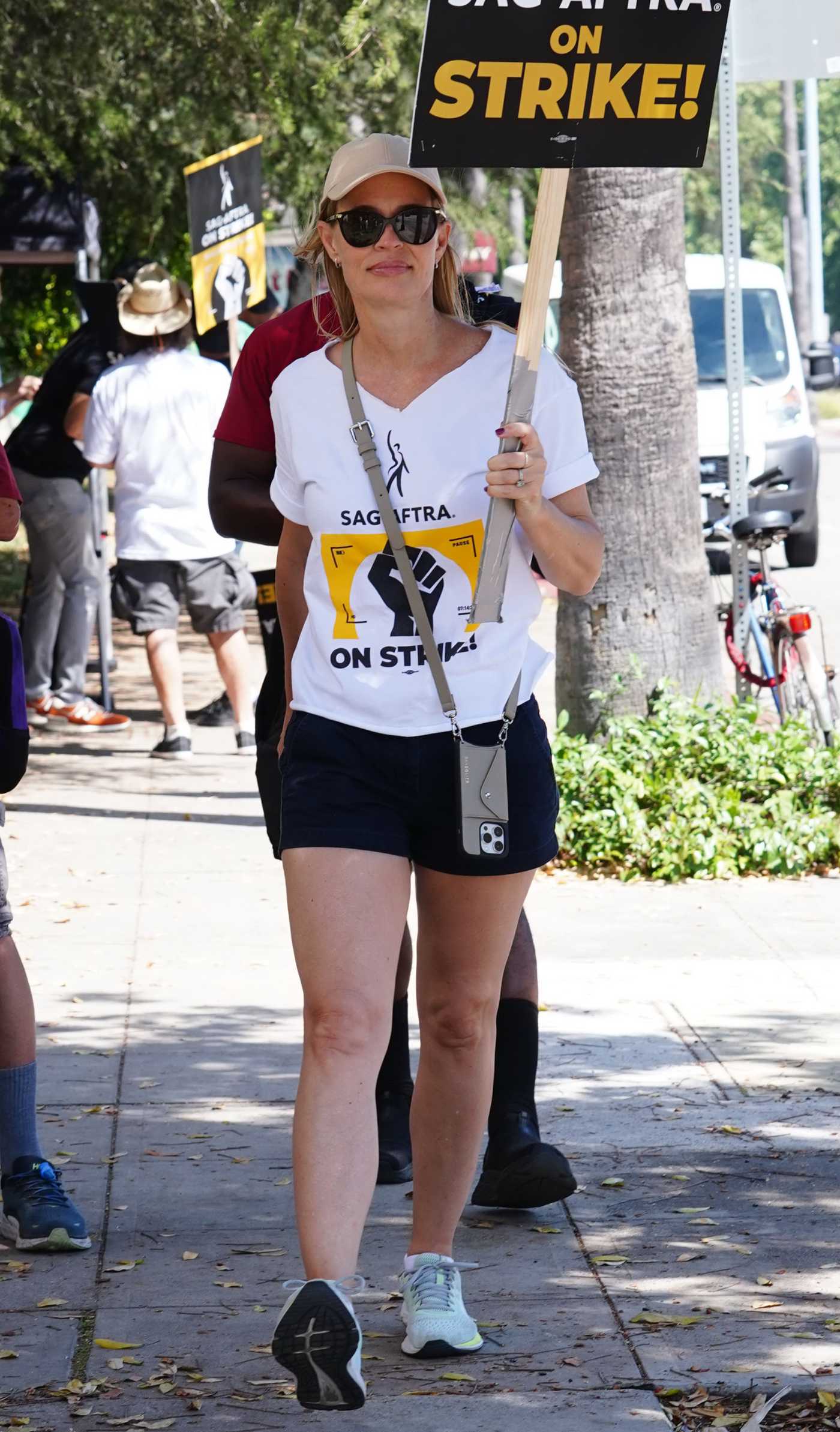 Jeri Ryan in a White Tee Attends  the SAG-AFTRA and WGA Strike at Warner Brothers Studios in Burbank 08/07/2023