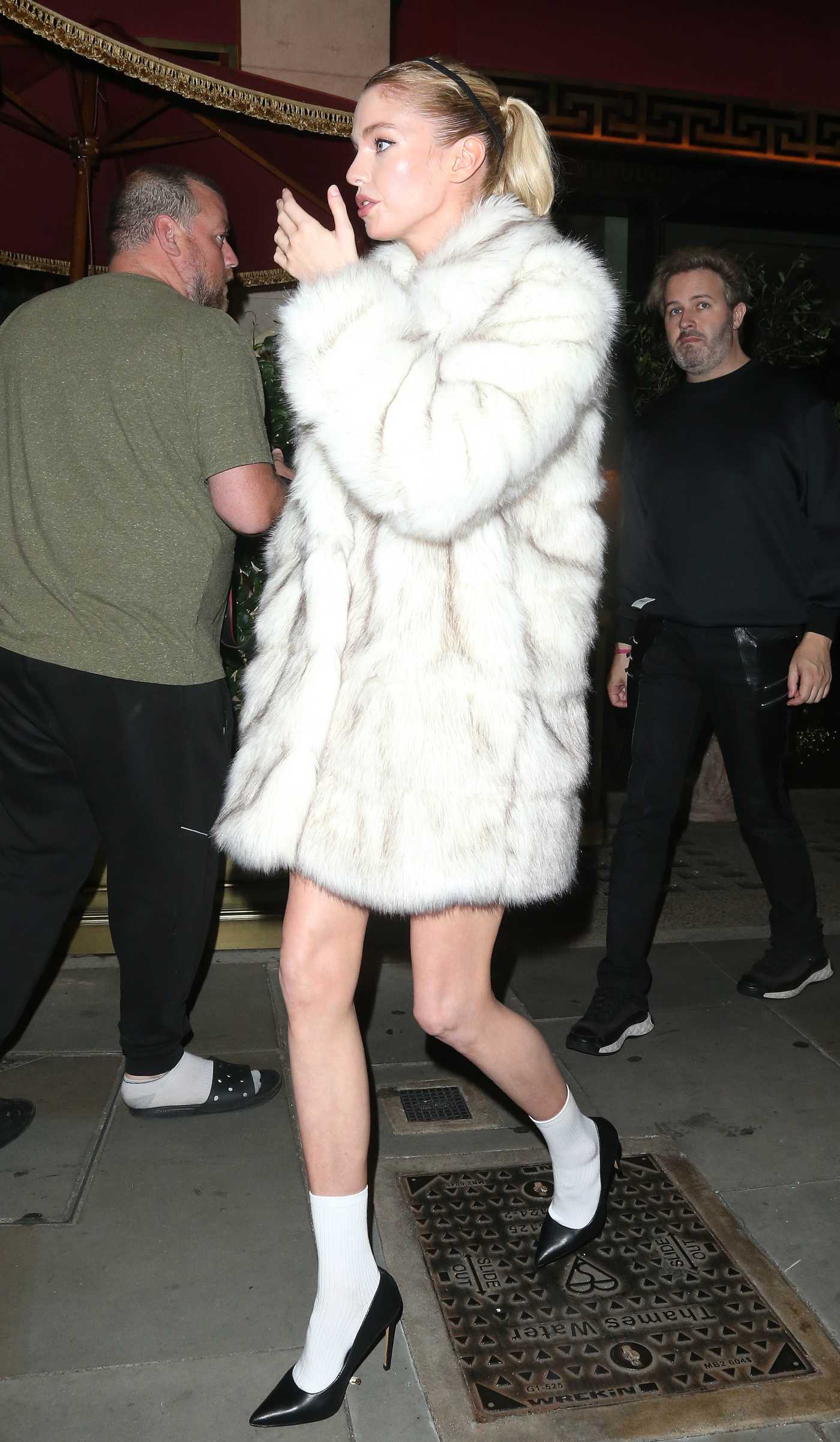 Stella Maxwell in a White Fur Coat Leaves Bacchanalia in Mayfair in London 09/15/2023