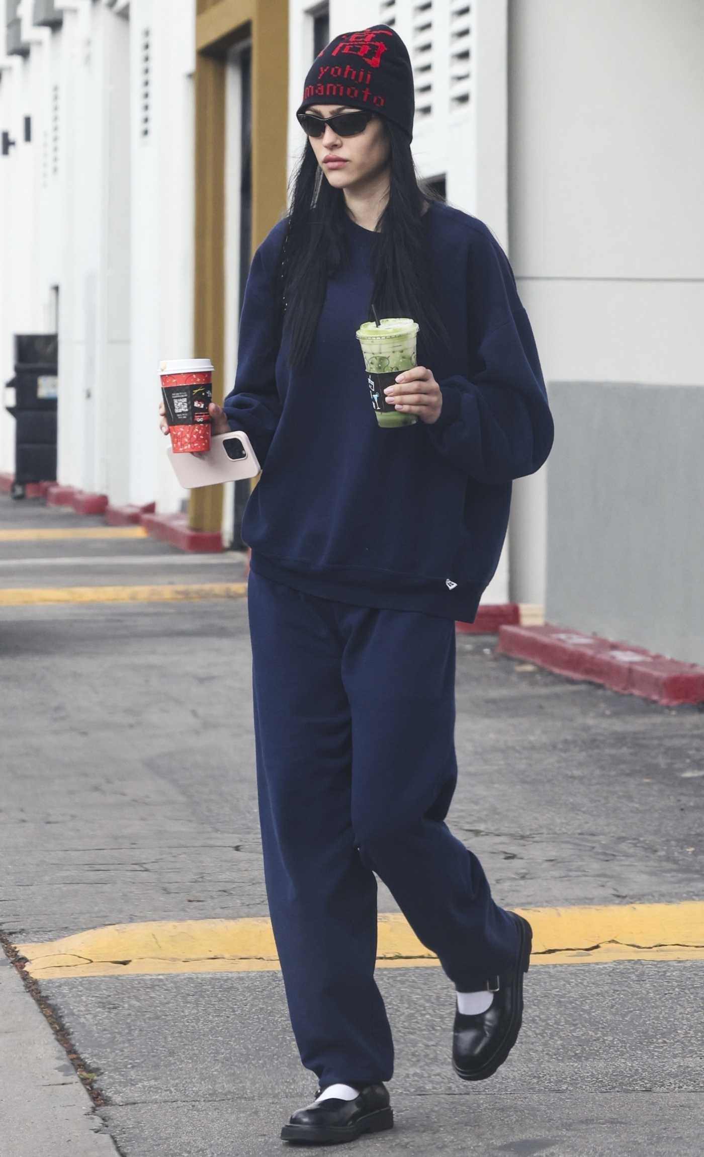 Amelia Hamlin in a Black Beanie Hat Leaves Alfred Coffee in Los Angeles 12/23/2023