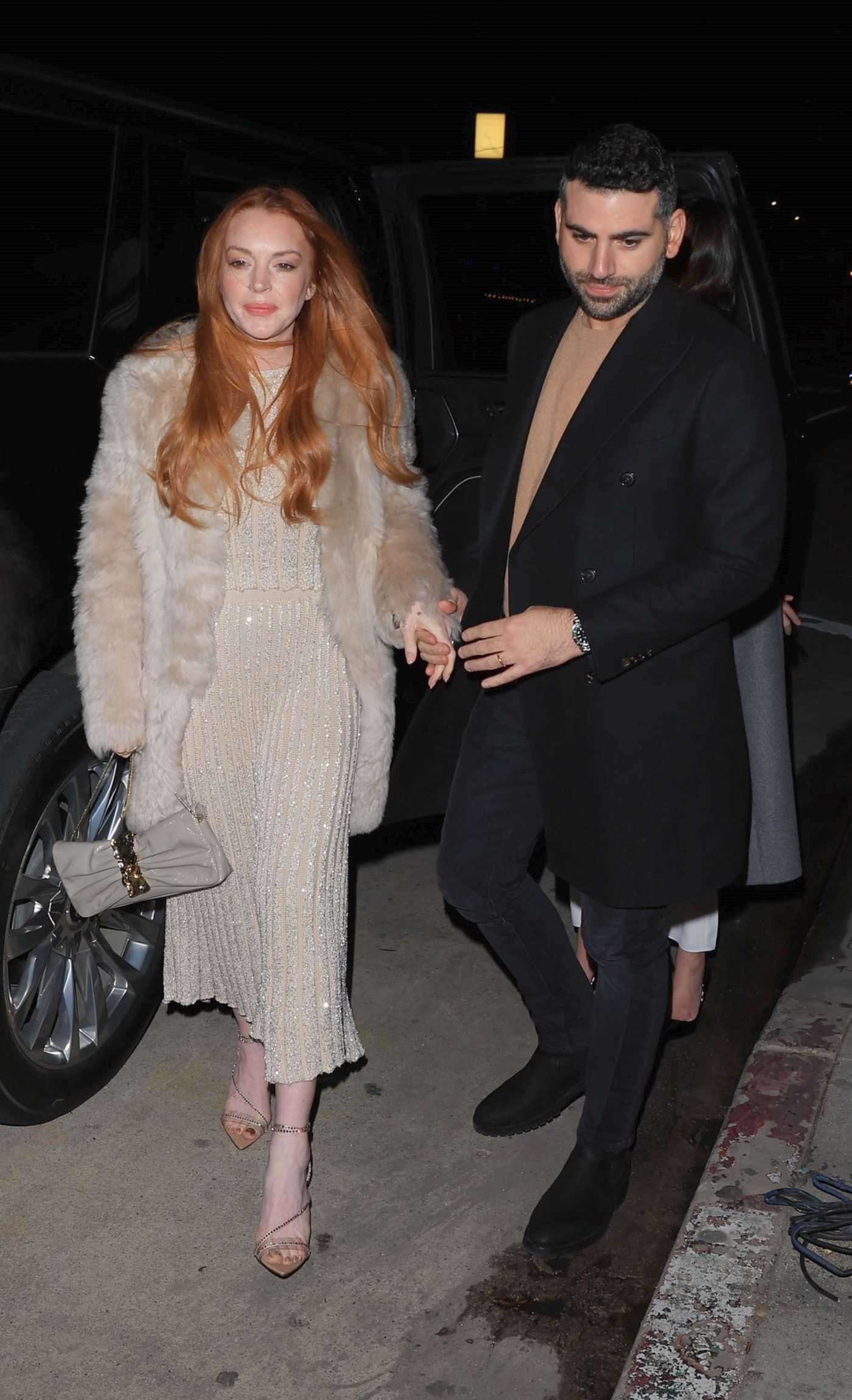 Lindsay Lohan in a Beige Fur Coat Arrives to a Dinner Outing with Her Husband Bader Shammas in LA 03/16/2024
