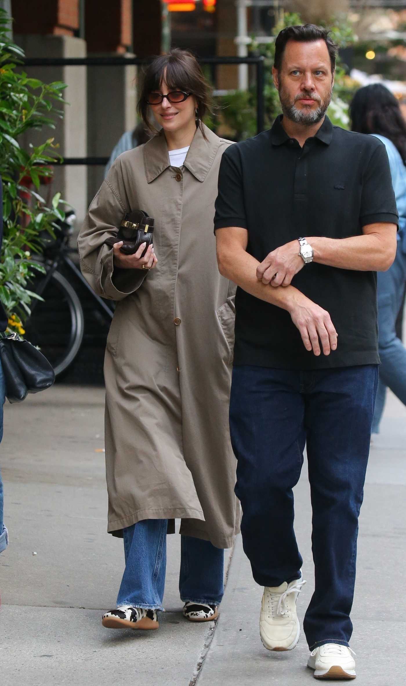 Dakota Johnson in a Beige Trench Coat Was Seen Out with Friends in New York City 06/03/2025