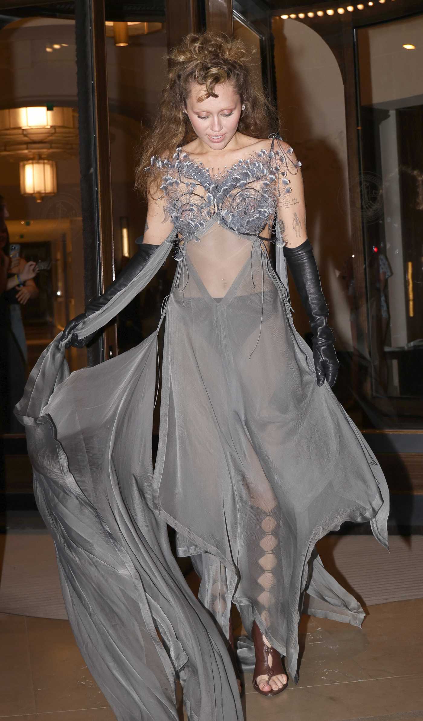 Miley Cyrus in a Grey See-Through Dress Was Seen Out in Paris 06/18/2025