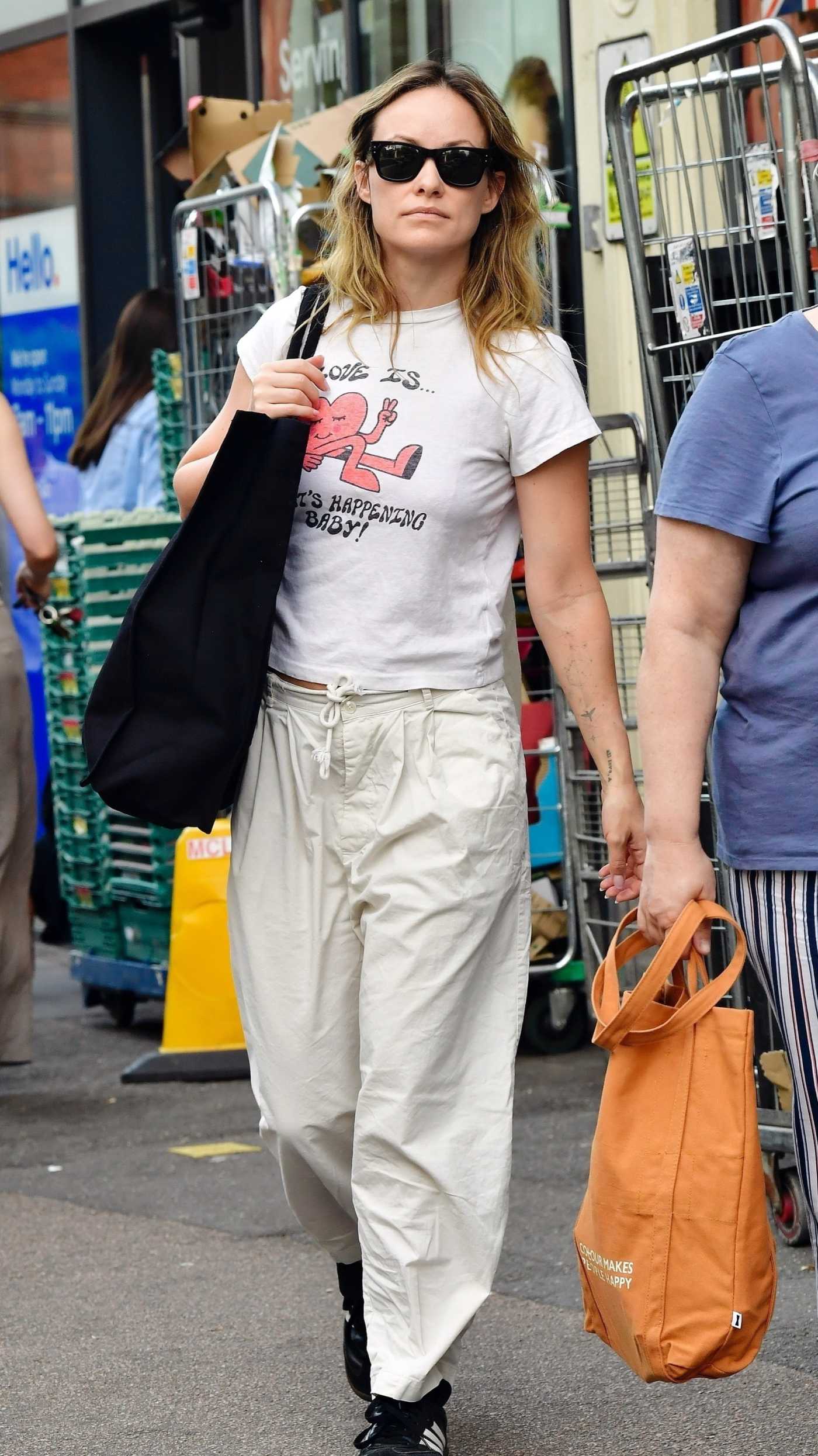 Olivia Wilde in a White Tee Out Shopping on Primrose Hill in London 07/15/2025