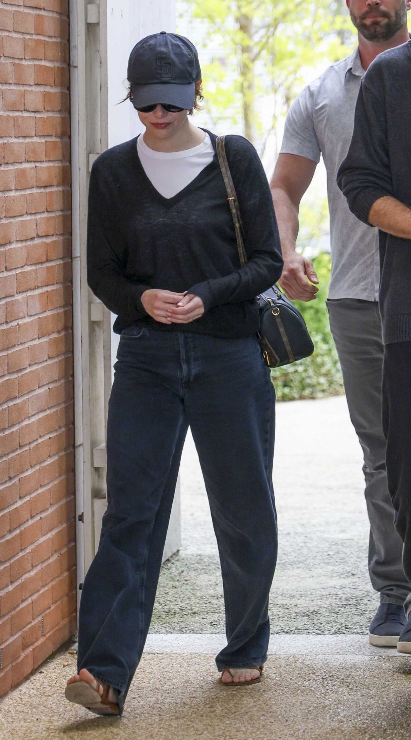 Emma Stone in a Black Cap Was Seen Out in Venice 08/26/2025