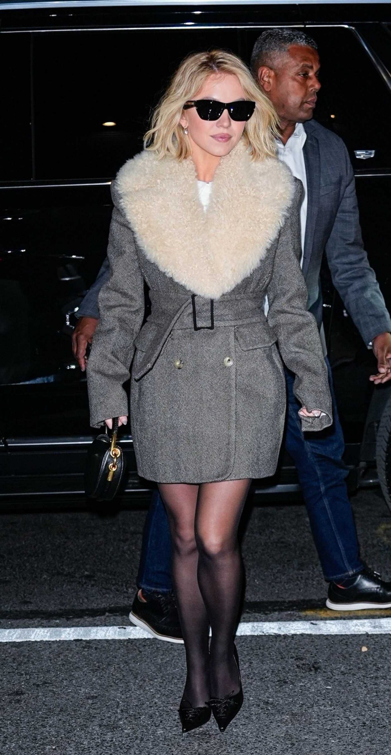 Sydney Sweeney in a Grey Coat Arrives at the Christy Screening in New York City 11/04/2025