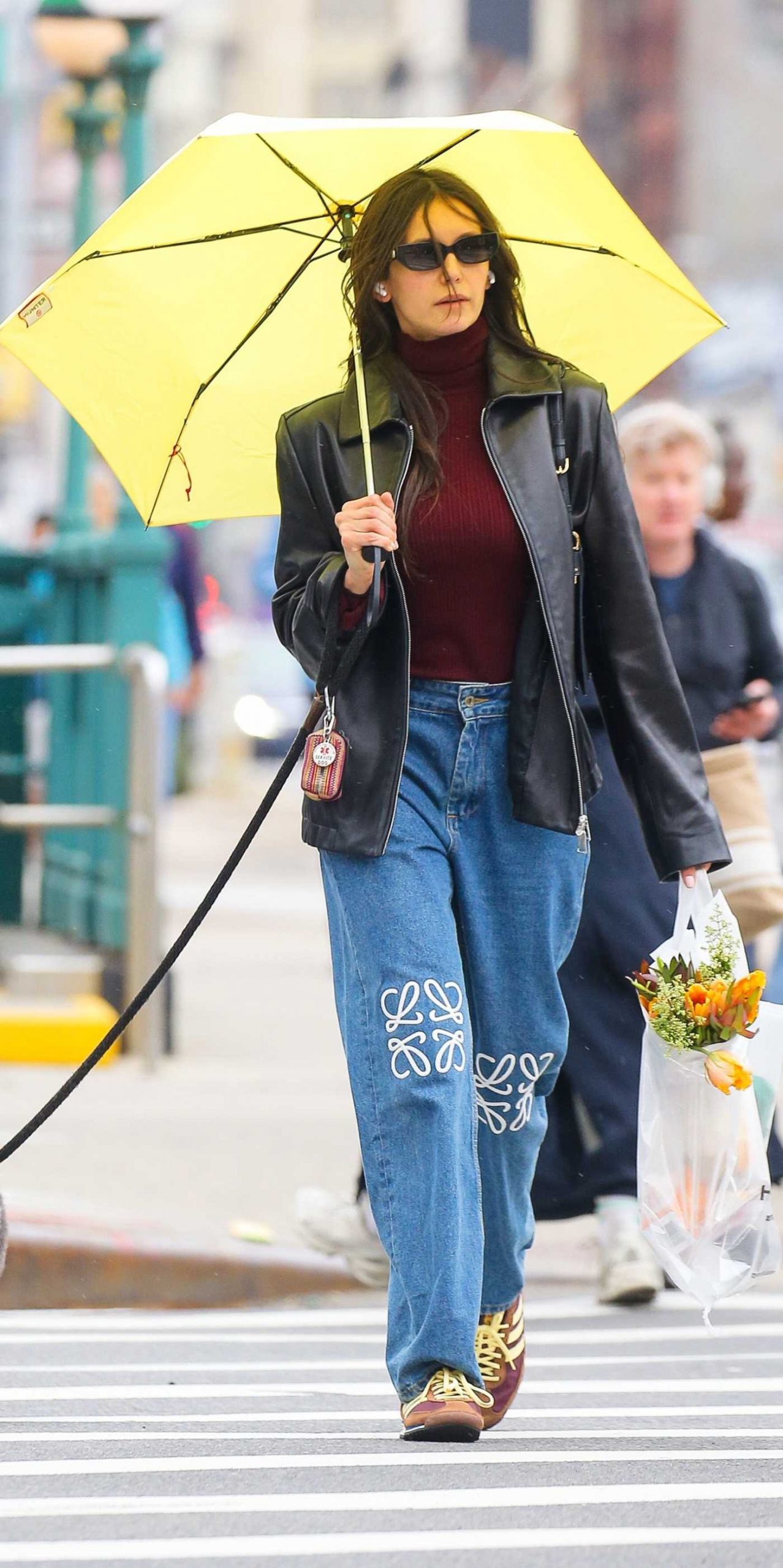 Nina Dobrev Deals with a Broken Umbrella on a Windy Day in New York City 04/04/2026