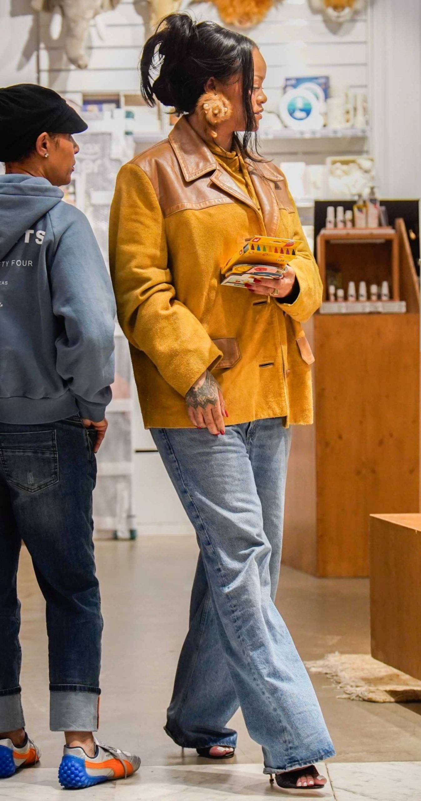 Rihanna in a Yellow Jacket Was Spotted During a Shopping Session at the Baby Store Bambino in Paris 04/18/2026