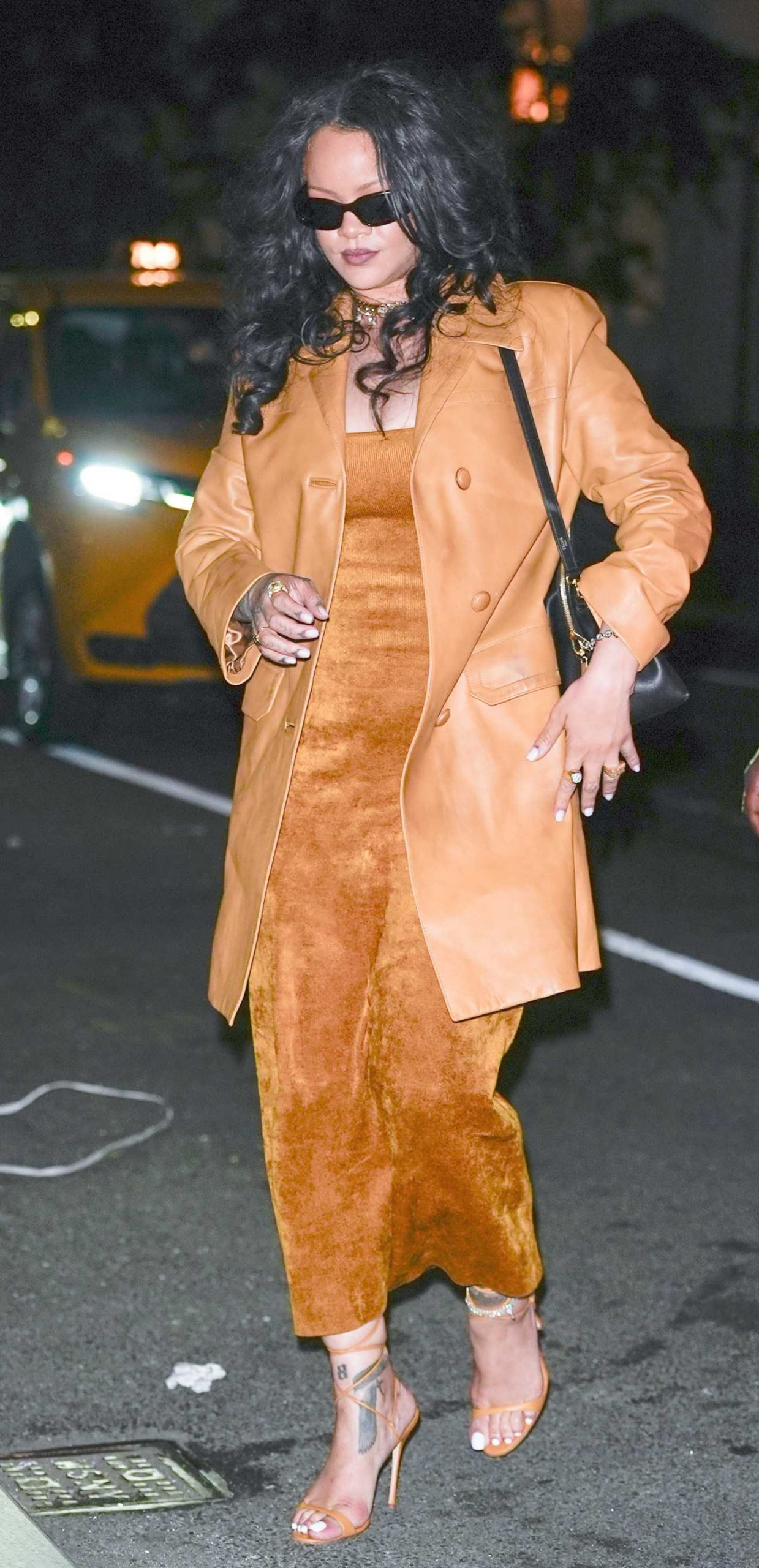 Rihanna in an Orange Leather Coat Heads Back to the Four Seasons Hotel After a Night Out in New York 06/09/2026
