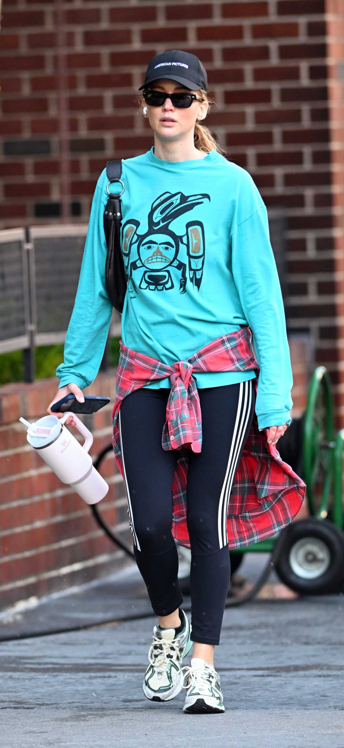 Jennifer Lawrence in a Black Cap on Her Way to the Gym in New York City 10/13/2026
